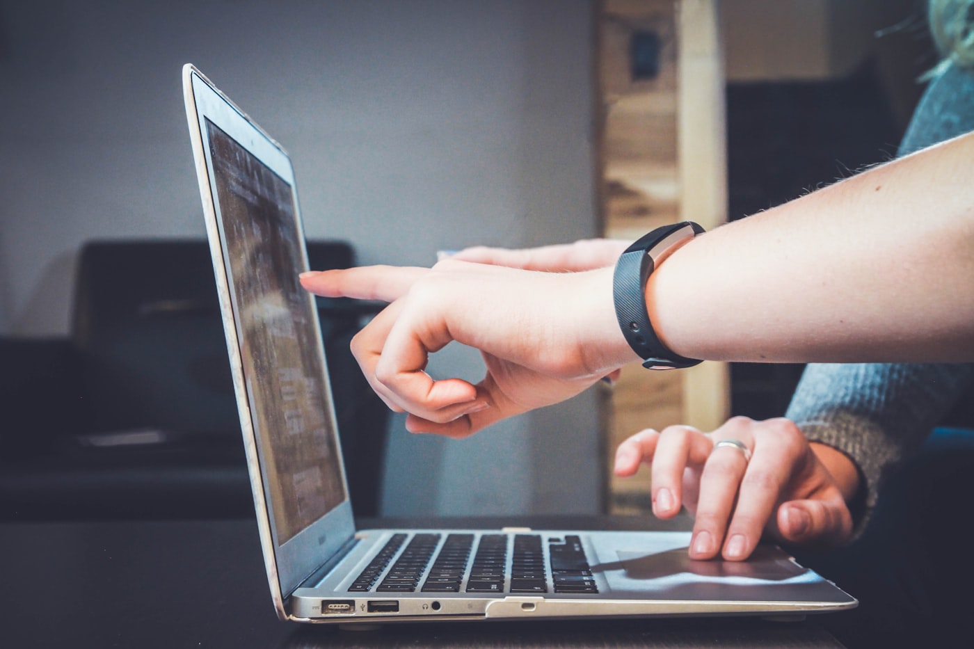 Someone creating and sharing content on a laptop